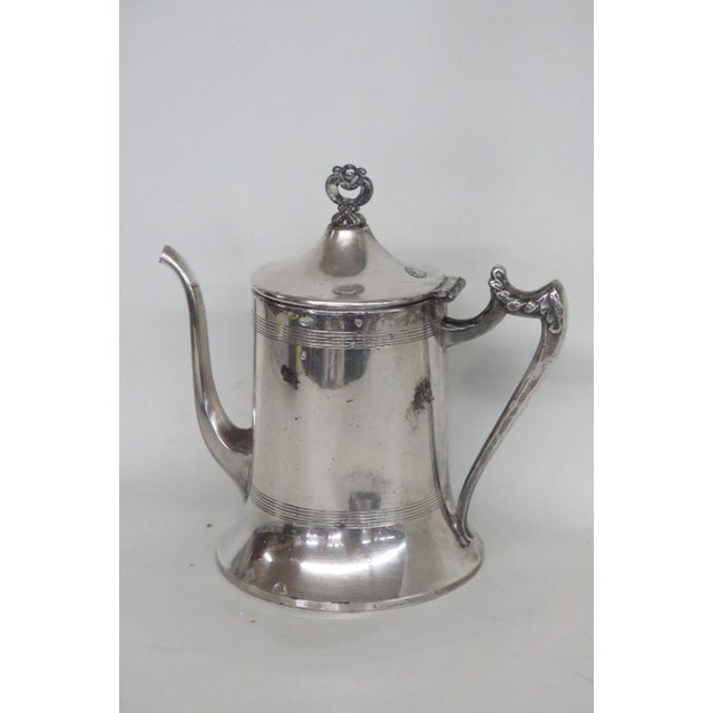 This gorgeous Lidded Tea / Coffee Pot is silver plated. The bottom of this beautiful pot is stamped with the following...