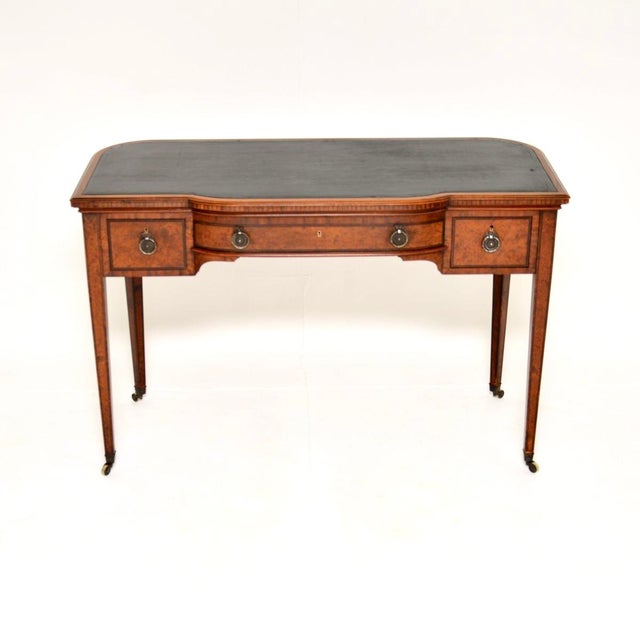 An outstanding antique Edwardian inlaid walnut desk / writing table. This was made in England, it dates from the 1900-1910...