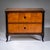Biedermeier chest of drawers featuring two drawers, crafted in cherry wood with expressive burl veneer and contrasting...