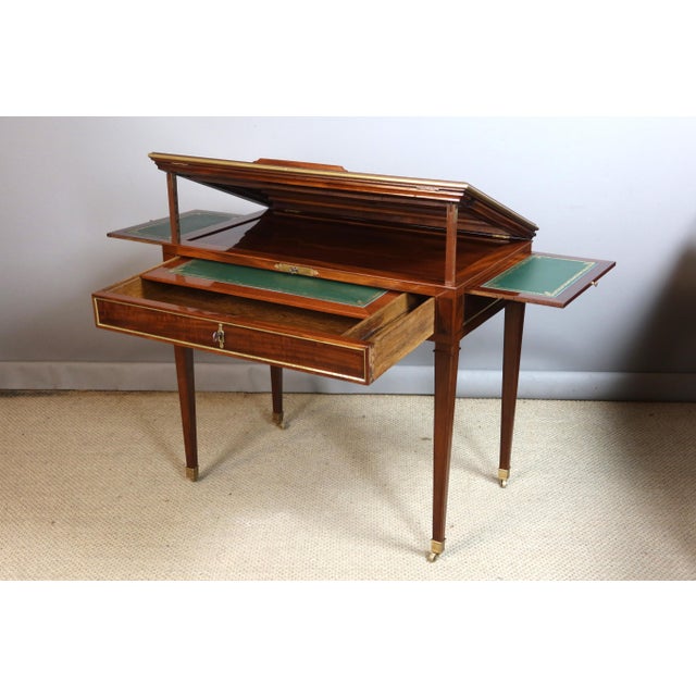 Directoire period desk, known as a "Tronchin" desk. This mechanical desk has been fully restored and French polished. The...