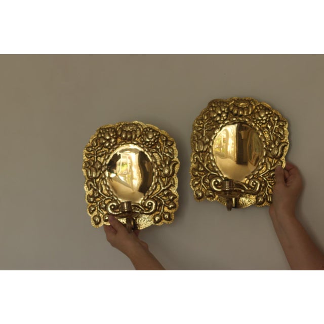 Pair of Mid-Century Swedish Brass Sconces Elegant Swedish mid-century brass wall sconces featuring a bold backplate and...