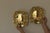 Pair of Mid-Century Swedish Brass Sconces Elegant Swedish mid-century brass wall sconces featuring a bold backplate and...