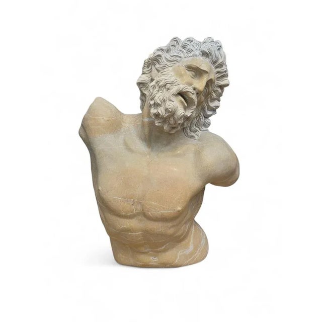 Striking sculpture of a faun’s torso, hand-carved in natural stone in Italy, likely during the 20th century. This...
