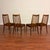 Set of four vintage slat back dining chairs made in the U.K. by G-Plan circa 1970's. These chairs feature afromosia...