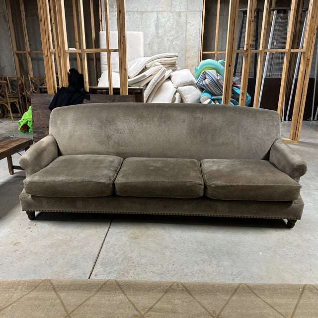 Custom Madeline Stuart Brett sofa was handcrafted in L.A. and features 3/4 inch brass nailheads at base of sofa front and...