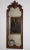 Luxurious wall mirror in a richly decorated frame made of solid oak, carved in the rococo style of Louis XV. It was made...
