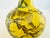 A striking vintage Chinese porcelain bottle vase decorated with a playful monkey among fruiting peach branches. The finely...