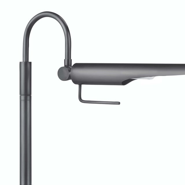 Its aerodynamic design with an adjustable shade, evoking a bird-like silhouette, makes this lamp a functional piece of...