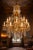 This impressive mid-20th-century French Louis XVI–style chandelier combines finely cast bronze, its original warm gilt...