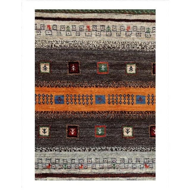Gabbeh rugs are made by the nomadic Qashqai tribes of southern region. They are rough cut and long piled rugs of rich...