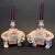 A delightful pair of Chinese export famille rose enameled porcelain candleholders, likely from the late Qing Dynasty or...