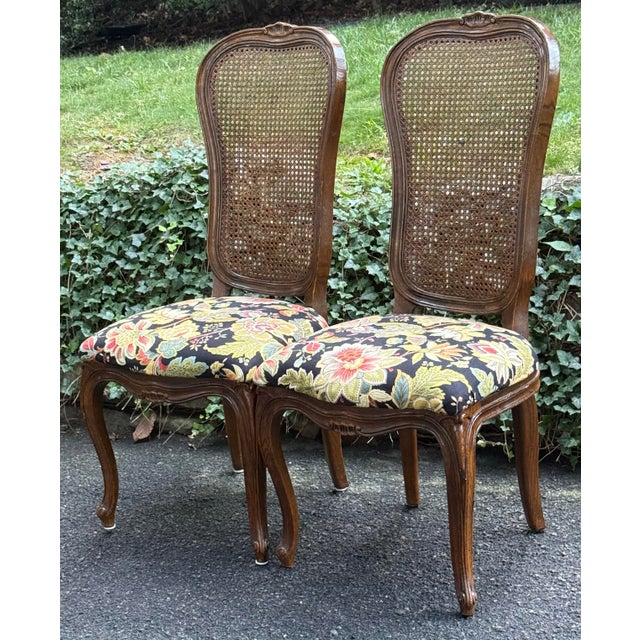 Lovely pair of Louis XV style dining chairs by century furniture. Features caned back , upholstered seats, cabriole legs...