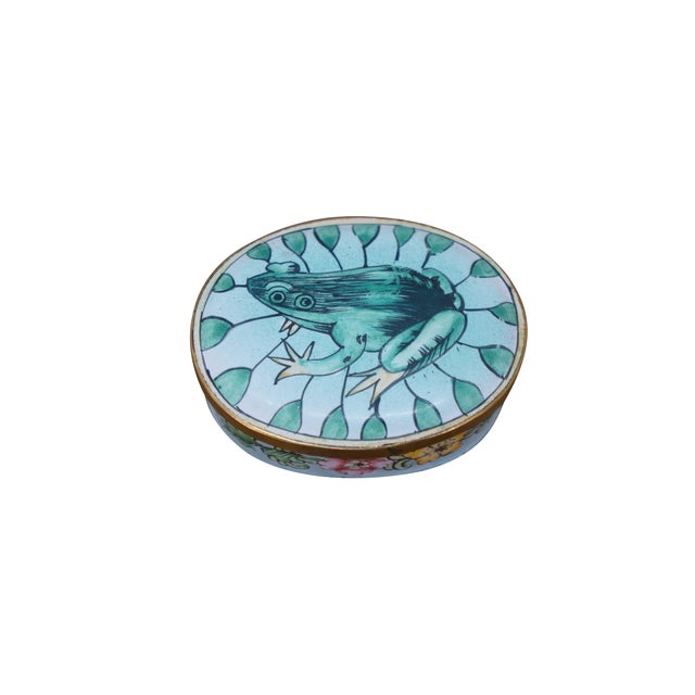 Vintage and antique enameled trinket boxes, including two floral made in France, and one frog on a lily pad design....