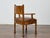 A finely crafted English armchair in burl wood, dating to the early 20th century, featuring a rich combination of clean...