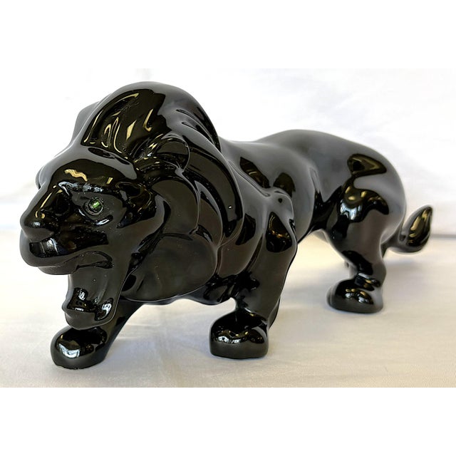 Awesome vintage lion figure from the mid 20th century. The poiece is made of ceramic with a jet black glossy glaze. He is...