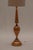 Elegant and sculptural French mid-century floor lamp from the 1960s, handcrafted from a single solid piece of turned wood....