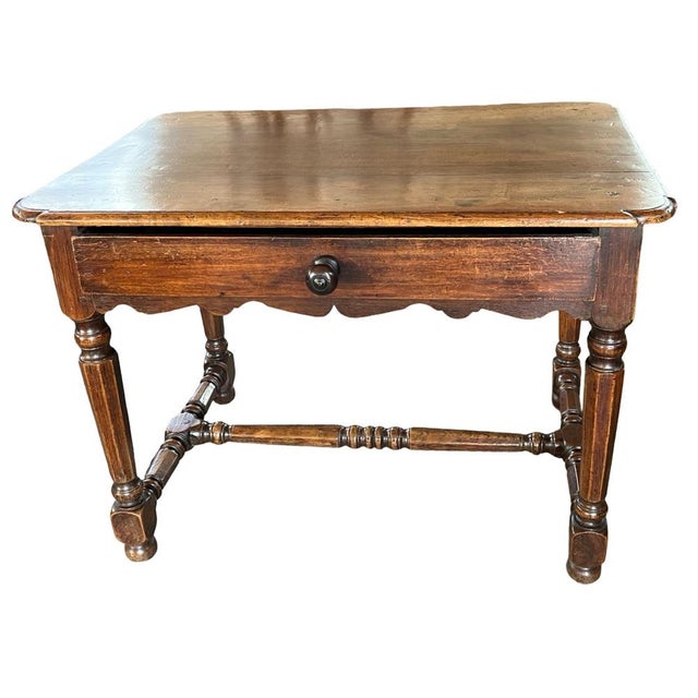 Side table hand-made in France in the mid 1800s using walnut and pegged construction. The table features a single, inset...
