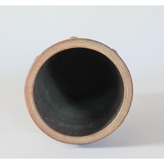 Mid-century studio art pottery umbrella stand in a grayish brown earth tone. No makers mark. Minor age wear. Pictured.