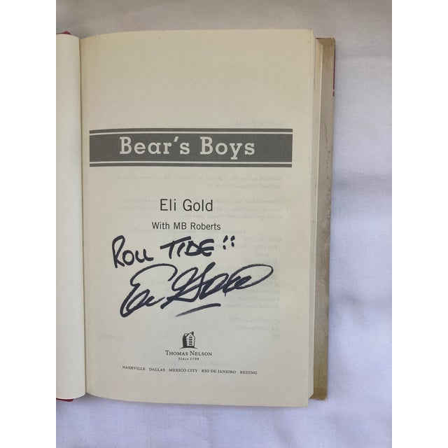 A 9 x 6 Hardbound Book with Original Jacket signed by Author Eli Gold who was known as The Voice of the University of...