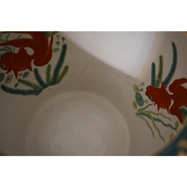 The gilt design and gold trim details as well as the deep green ground make this set of Canton Chinese jardinieres unique....