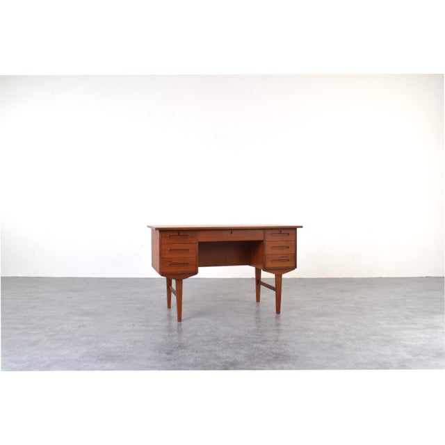 This teak desk was manufactured in Denmark in the 1960s. The piece has been professionally and carefully restored by...