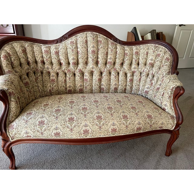 Victorian Love Seat. Recovered. Left front leg repaired (see last picture). Good condition.