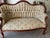 Victorian Love Seat. Recovered. Left front leg repaired (see last picture). Good condition.