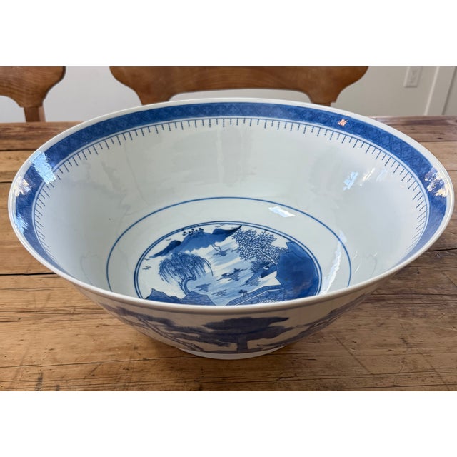 Large Chinese export porcelain Canton blue and white centerpiece punch bowl dating from the mid-20th century. Decorated...