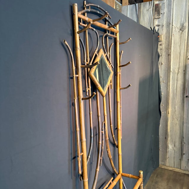 Antique burnt bamboo hall tree, showcasing the natural elegance and craftsmanship associated with the Aesthetic Movement....