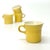 Yellow cups, group of 4. A timeless modern classic group of muted yellow and white cups. Made in the USA. Height: 3.25"...