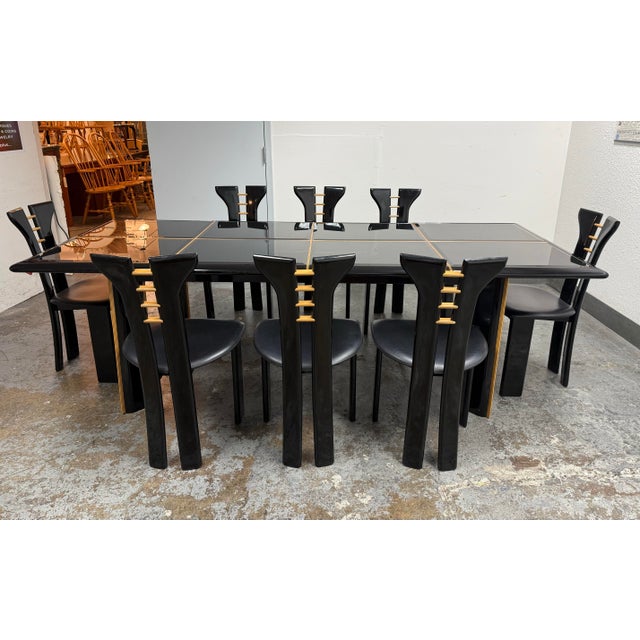 Design Plus Gallery presents a Vintage Black Lacquer Extension Dining Table + Eight Chairs by Pierre Cardin from Roche...