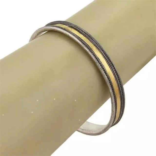 This is an elegant bangle by Gurhan from the LANCELOT collection, it is crafted from sterling silver and 24k gold with a...