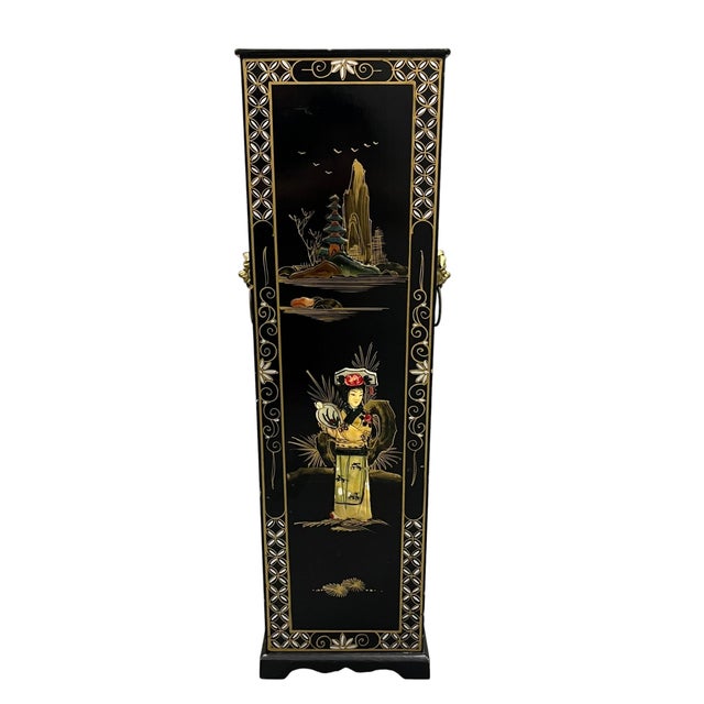 A striking vintage Chinoiserie umbrella stand featuring a glossy black lacquer finish accented with intricate hand-painted...