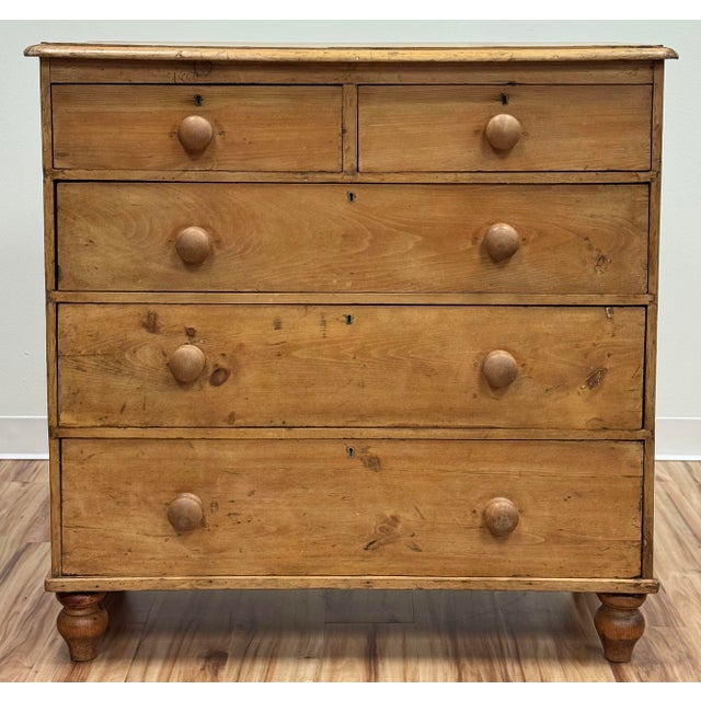 Stunning 19th Century Victorian English pine chest of drawers. Two over three drawers. Features a natural medium finish,...