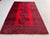 A vintage Afghan Ersari Turkmen rug in the bold main-carpet style — a single central column of four oversized octagonal...