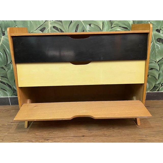 Mid-Century German Red, Yellow and Black Formica Shoe Cabinet, 1950s, in Good conditions. Designed 1950 to 1959