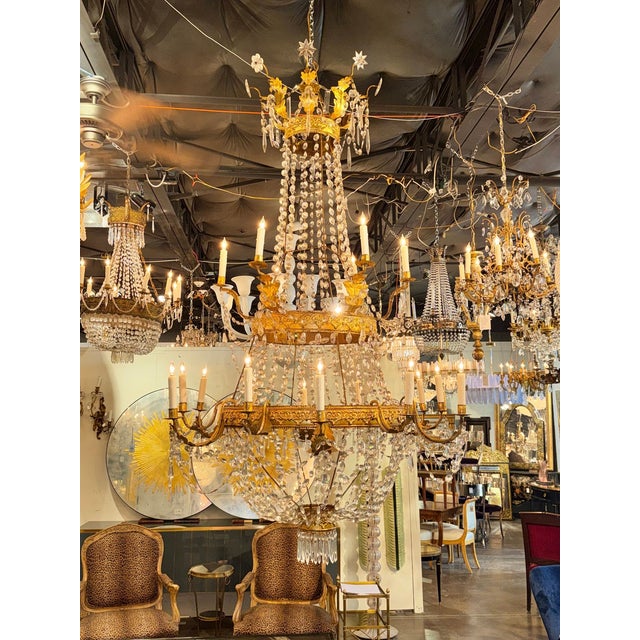 This exquisite late 18th century Italian Empire chandelier is a true palace-sized statement piece for any home. With its...