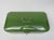 A forest green enameled bread box from the Art Nouveau period. The lid is decorated with two enameled silver stripes...