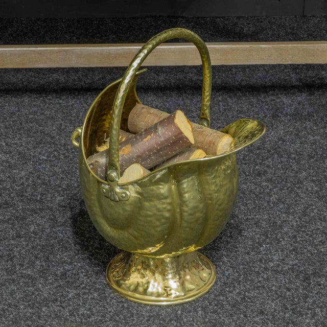 A fine and unusual brass coal helmet of a 'Nautilus' shell shape. Quite possibly originating from a coastal environment....