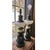 A striking pair of mid-century table lamps converted from oil lamp originals, each featuring a deep hunter green ceramic...
