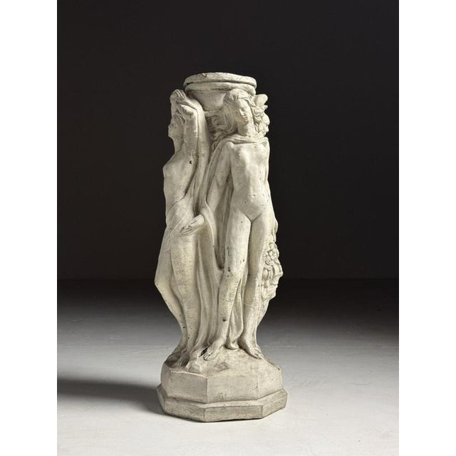 20th-century classical pedestal / garden statue of The Three Graces. The Three Graces are three goddesses from Greek and...