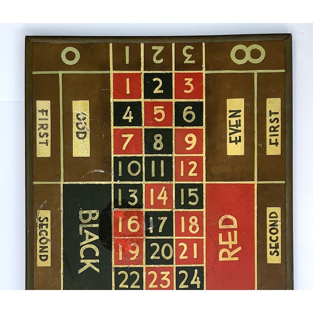 Nice alligatored surface on this circa 1940s gambling game board, hand painted on masonite with original metal frame....
