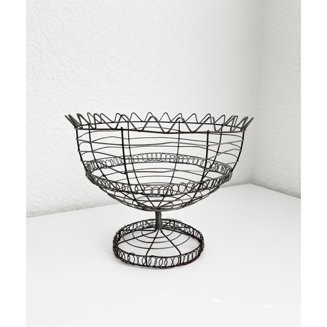Vintage, rustic French style footed basket with pleasant patina. Handmade of twisted metal wire , looped and bent into...