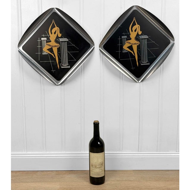 A Pair of 1950's Atomic Era Aluminum Wall Plaques Concaved Polished Aluminum with Black & Gold Enameled Centers Shows a...