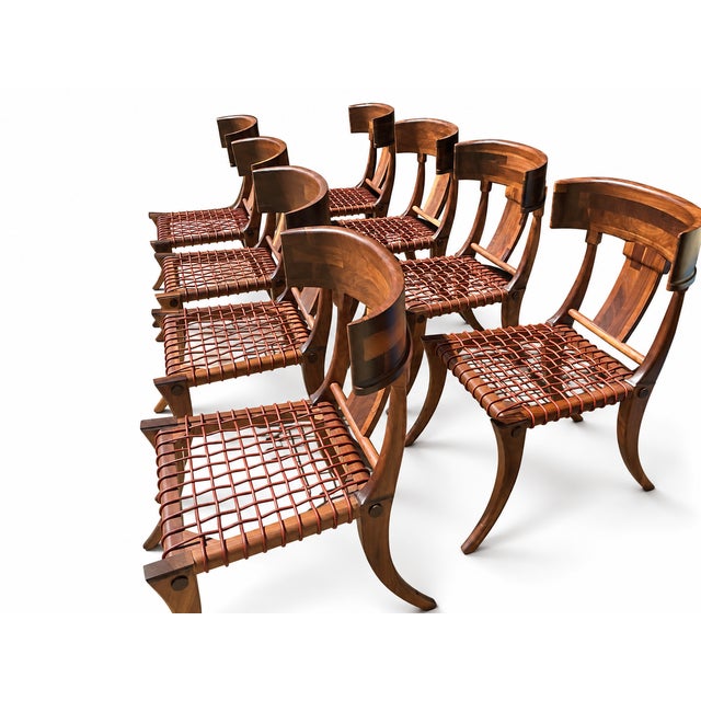 Solid walnut Robsjohn Gibbings style Klismos dining chairs. The chairs are in flawless condition. Satin finish. Leather...
