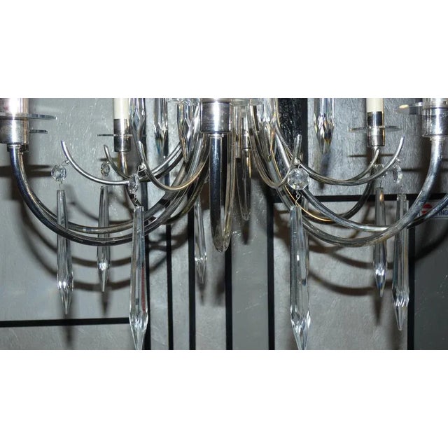 Precious chandelier from sciolari's ovali collection produced in the 1960s/70s. The frame is made of silver, the saucers...