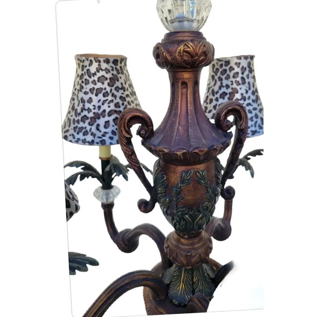 A wonderful vintage 5 light tole style chandelier light fixture. The chandelier features 5 arms with lucite detail and...