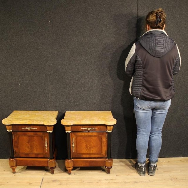 A pair of Italian bedside tables from the second half of the 20th century. Veneered and inlaid in mahogany, walnut,...