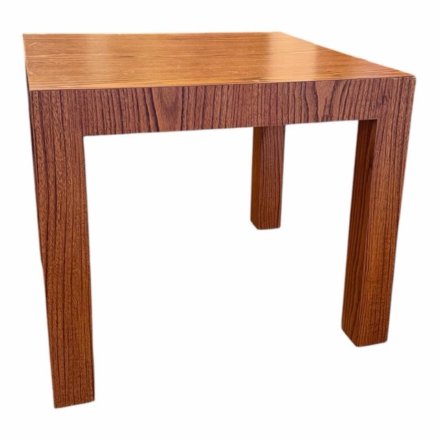 A generously sized vintage 1970s parsons style bohemian wood-grain laminate side table with a warm wood-grain faux finish...