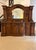 Monumental antique Victorian exhibition quality carved oak sideboard by Maple and Co. having an arched shaped bevelled...
